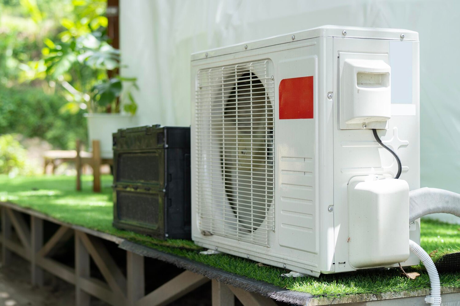Air conditioner compressor outdoor unit installed outside the geodesic dome tent for camping